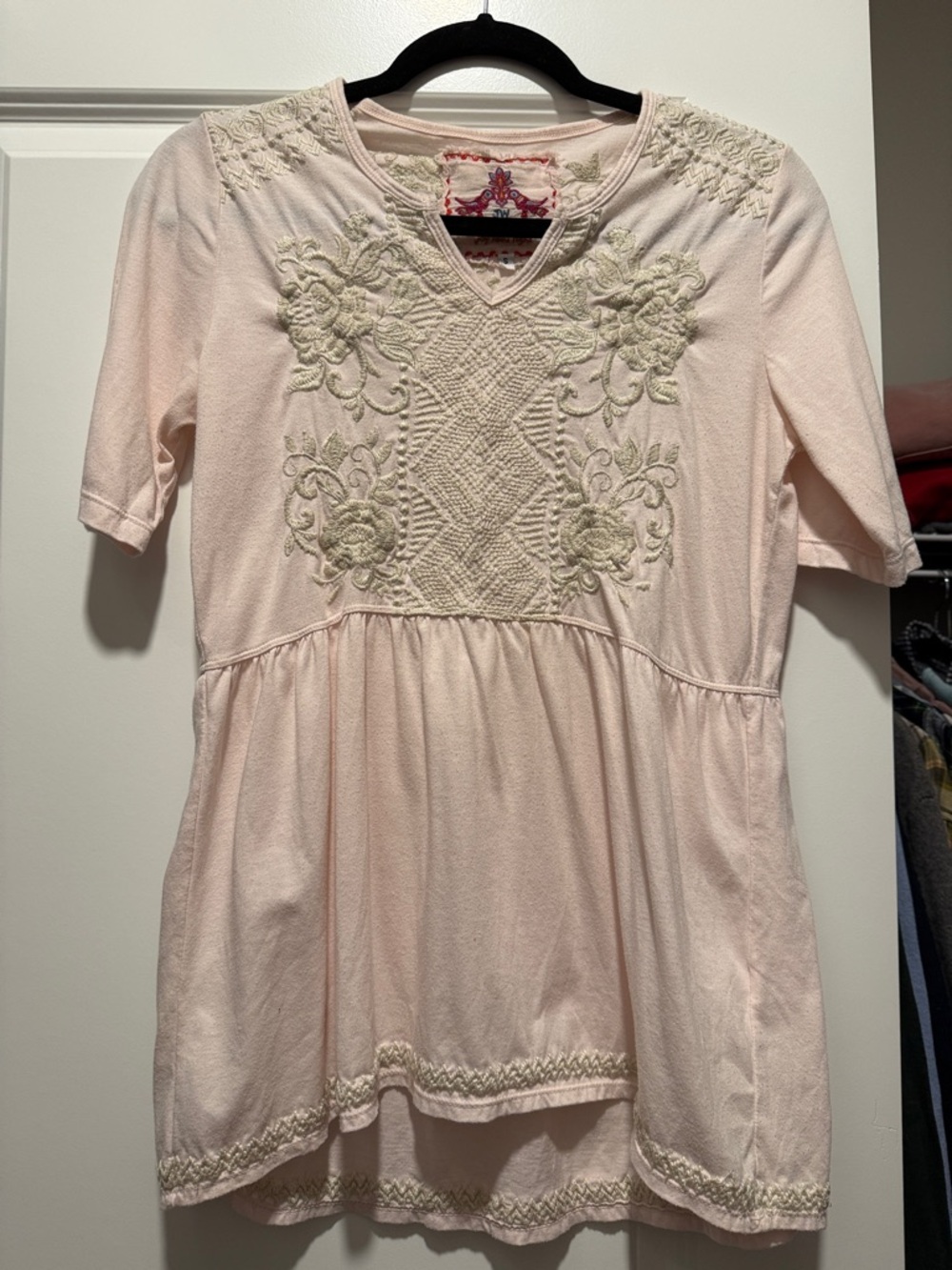 Embroidered V-Neck Peplum Blouse in Pale Pink